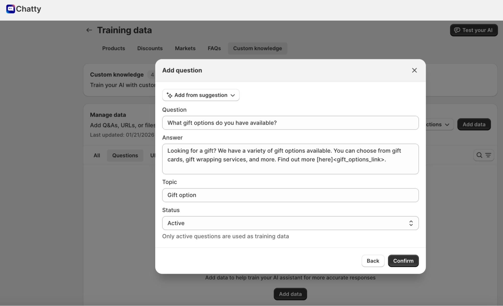 Chatty AI custom knowledge training modal showing how to add questions and answers to improve chatbot responses using store-specific information